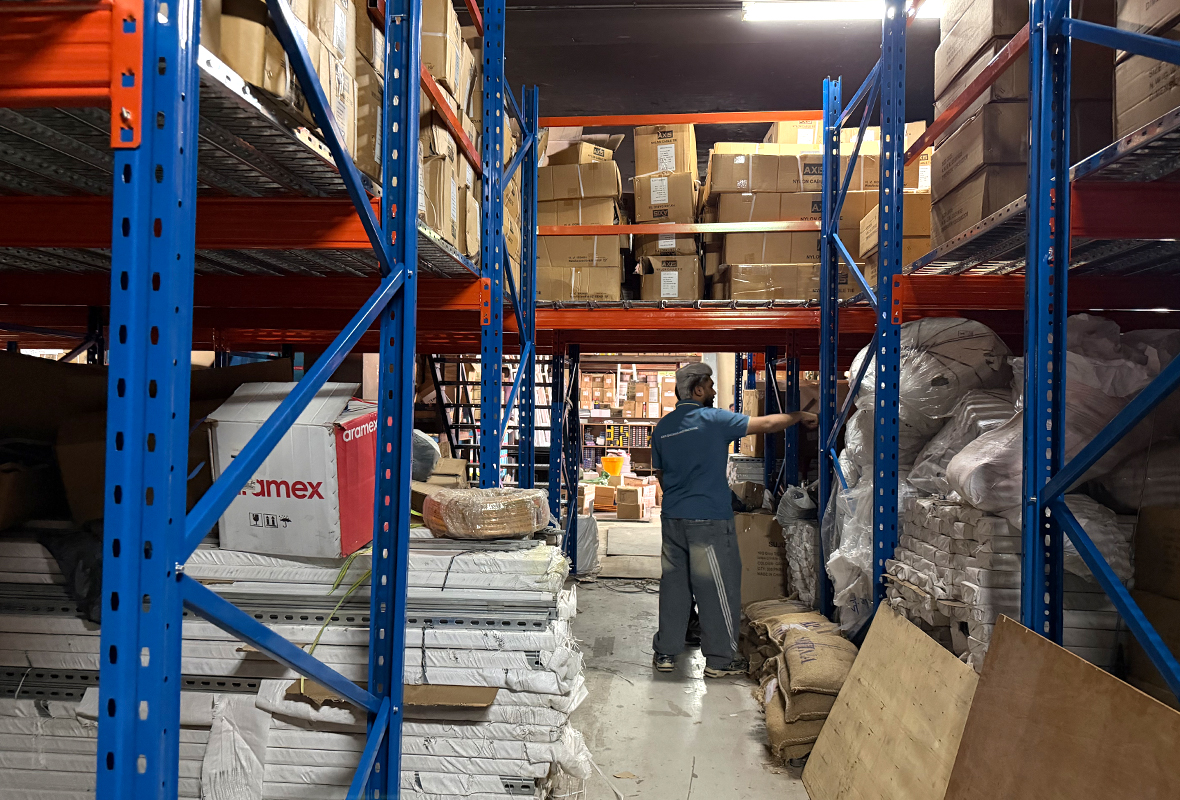 Heavy-duty rack-supported mezzanine floor system manufactured by GXM, compliant with Dubai Municipality standards.