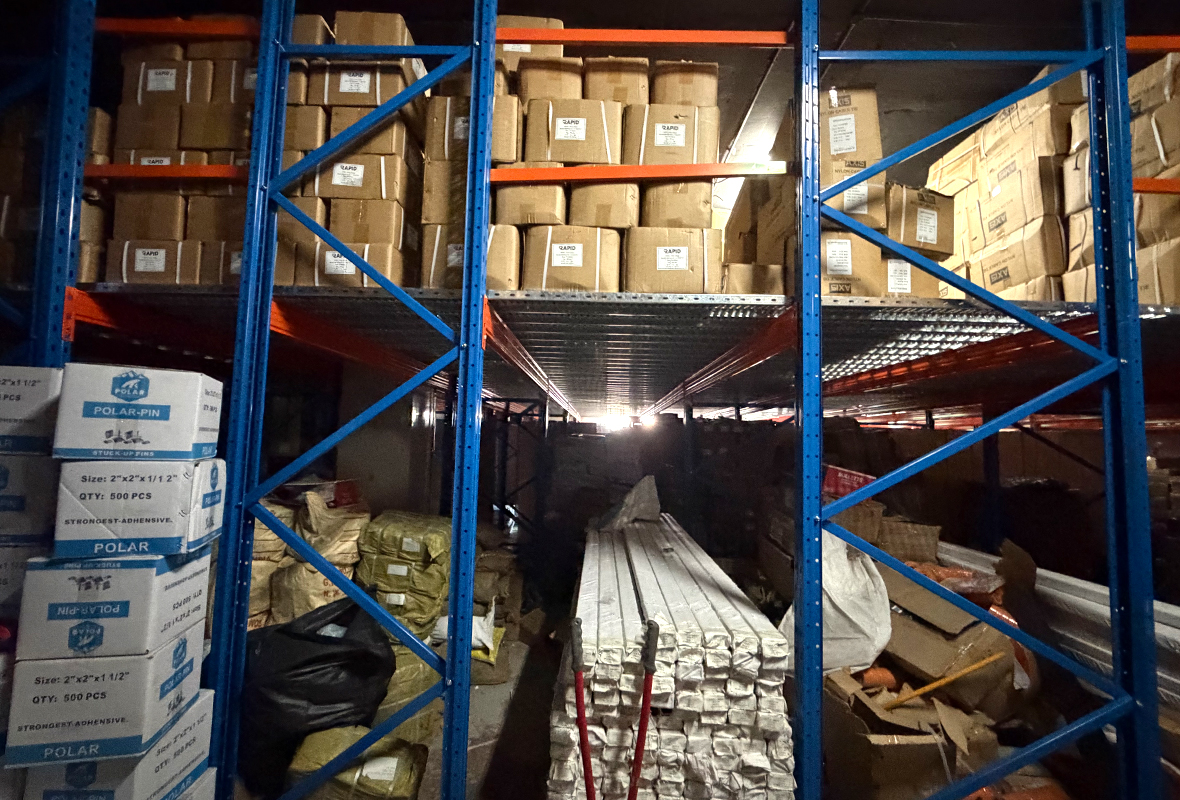 Heavy-duty rack-supported mezzanine floor system manufactured by GXM, compliant with Dubai Municipality standards.