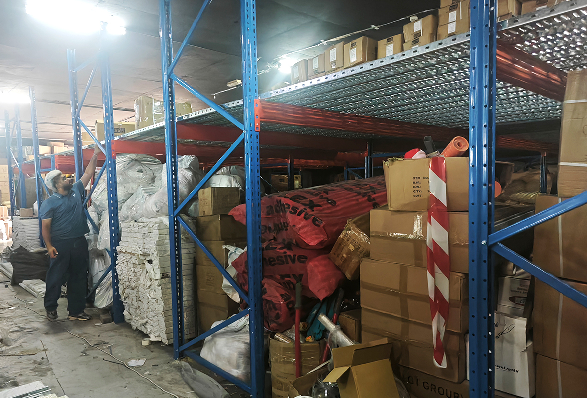 Heavy-duty rack-supported mezzanine floor system manufactured by GXM, compliant with Dubai Municipality standards.